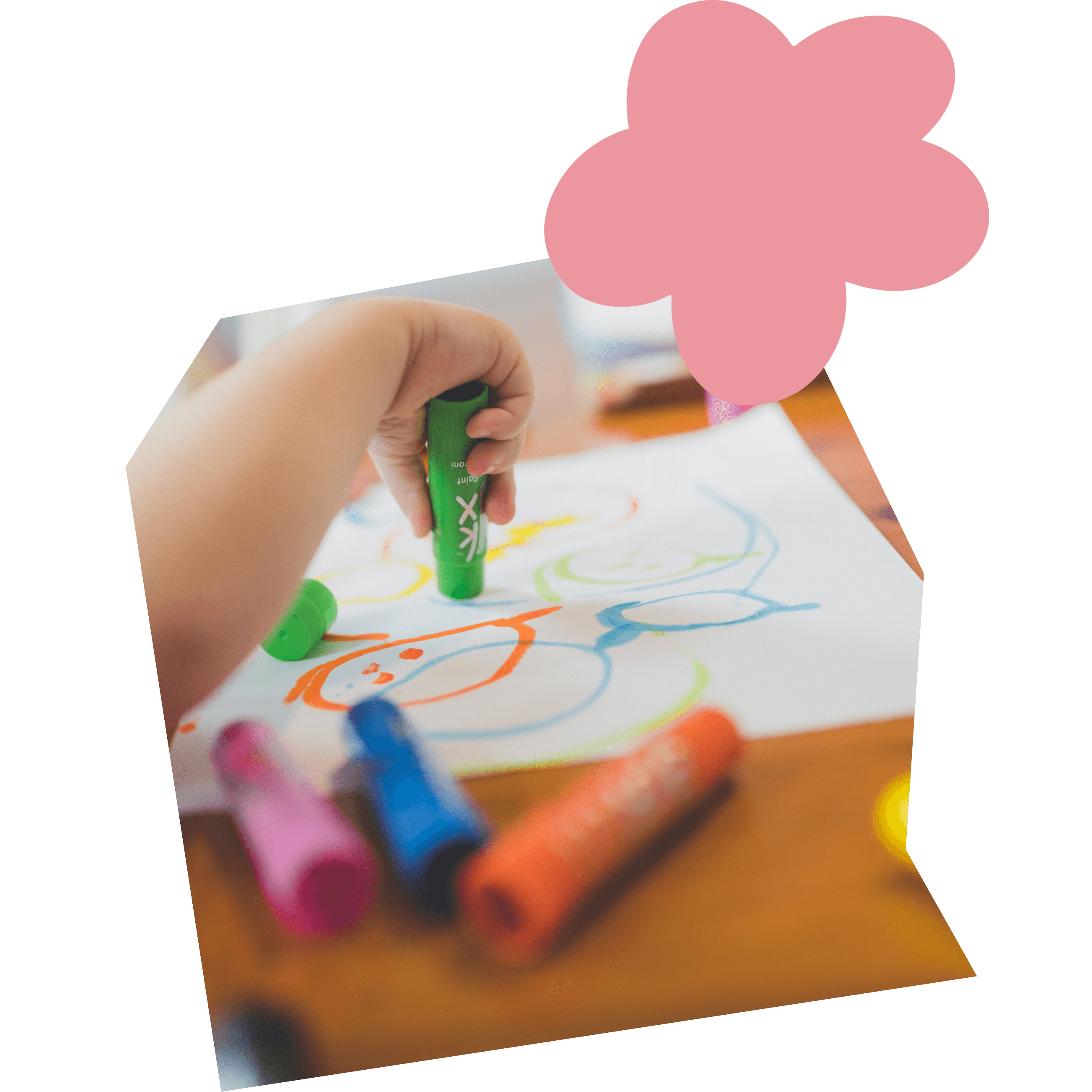 Image of a child coloring with markers
