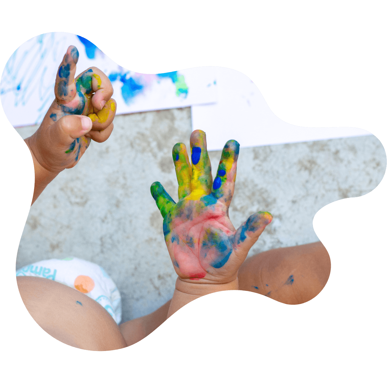 Image of a child with paint covered hands