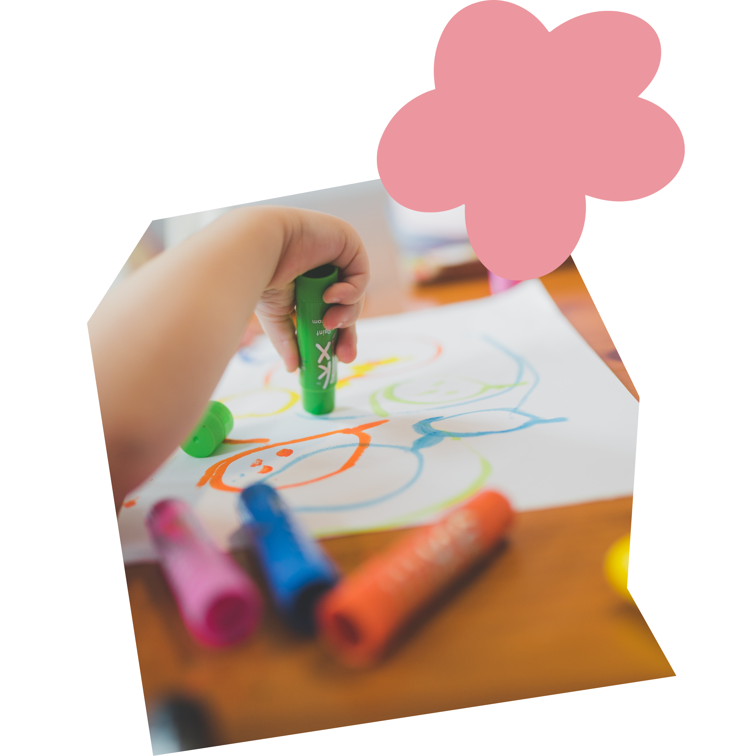 Image of a child coloring with markers
